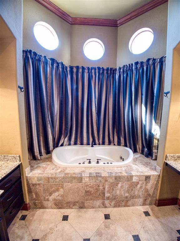 7 Country Club Rd, Shawnee, OK 74801 - bathroom featuring vanity, tiled bath, and crown molding
