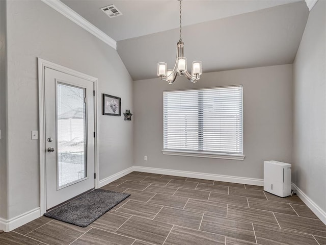 doorway to outside featuring vaulted ceiling and a notable chandelier