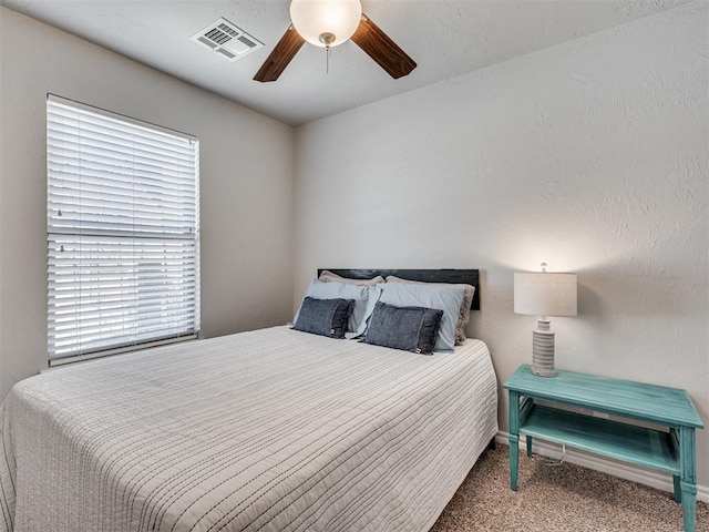 bedroom with ceiling fan and carpet flooring