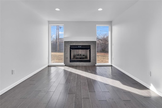 unfurnished living room featuring dark wood-type flooring