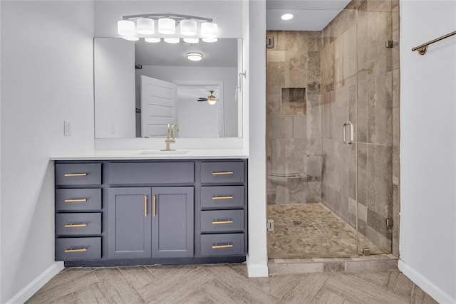 bathroom with vanity and a shower with shower door