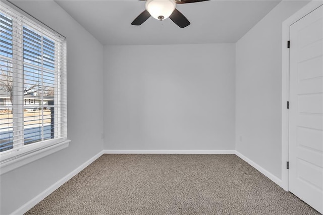 spare room with carpet flooring and ceiling fan