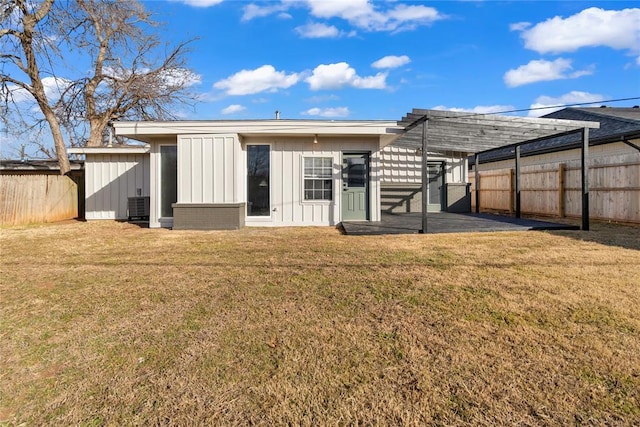 rear view of house with a patio, a pergola, central AC, and a lawn