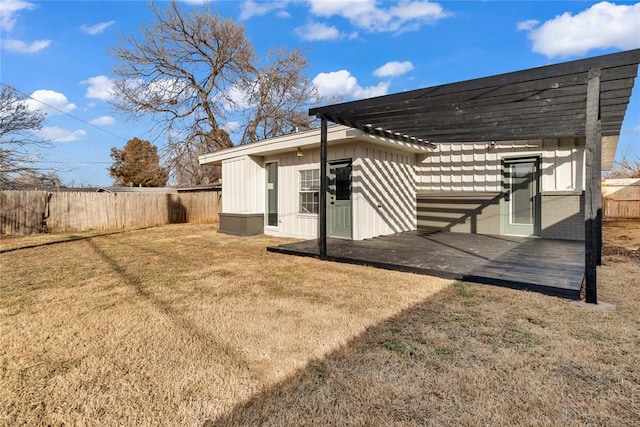 back of house with a yard