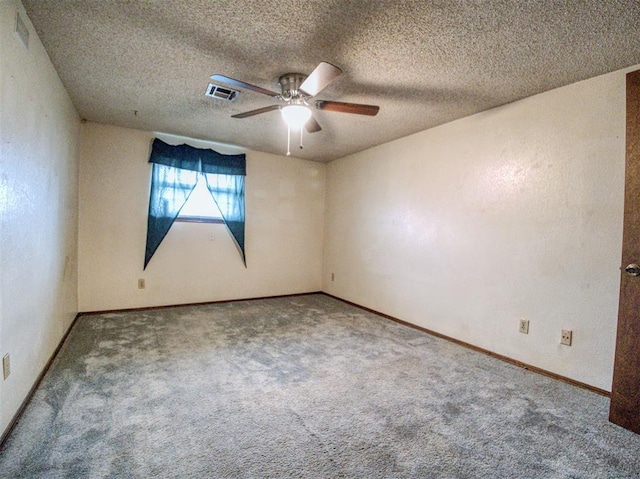 unfurnished room featuring a textured ceiling, ceiling fan, and carpet