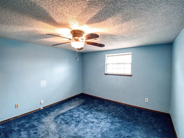 empty room featuring a textured ceiling, ceiling fan, and carpet