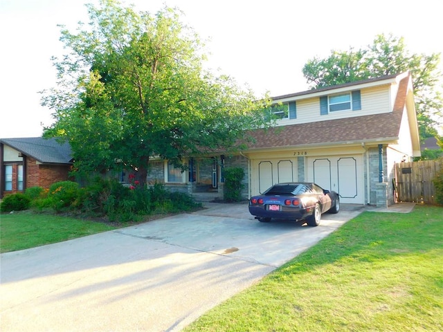 7318 Hummingbird Cir, Oklahoma City, OK 73162 - view of front of property with driveway, a garage, a shingled roof, and stone siding
