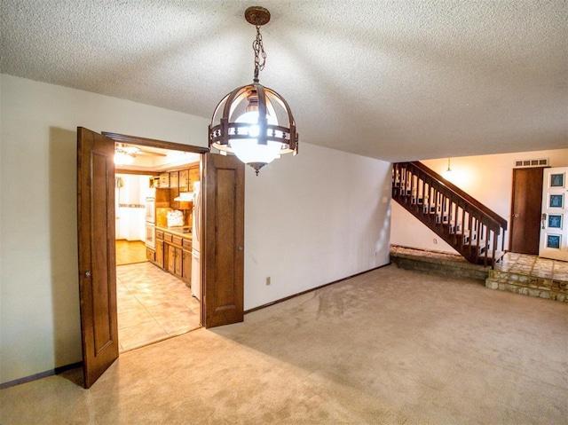 7318 Hummingbird Cir, Oklahoma City, OK 73162 - unfurnished living room with stairs, light carpet, and a textured ceiling