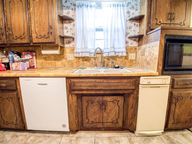 7318 Hummingbird Cir, Oklahoma City, OK 73162 - kitchen with dishwasher, open shelves, black microwave, brown cabinetry, and wallpapered walls