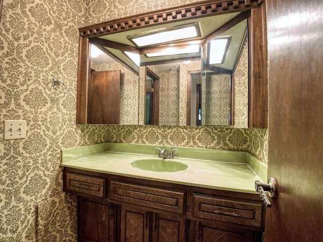 7318 Hummingbird Cir, Oklahoma City, OK 73162 - bathroom with wallpapered walls and vanity