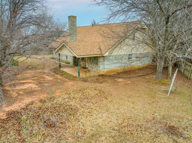 7318 Hummingbird Cir, Oklahoma City, OK 73162 - view of side of property with a chimney and a patio