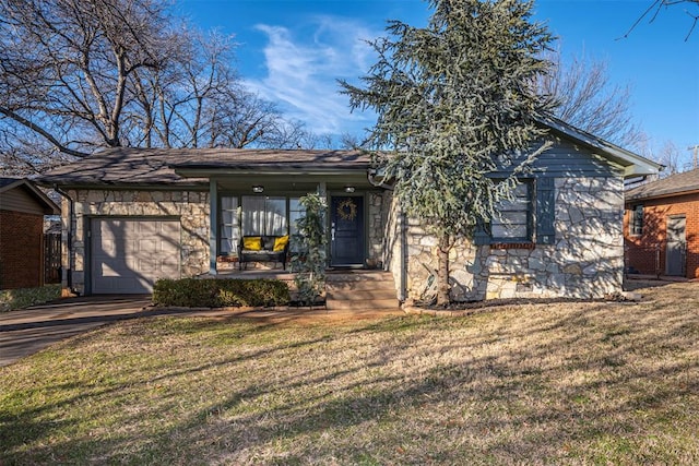 view of front of house with a garage and a front lawn