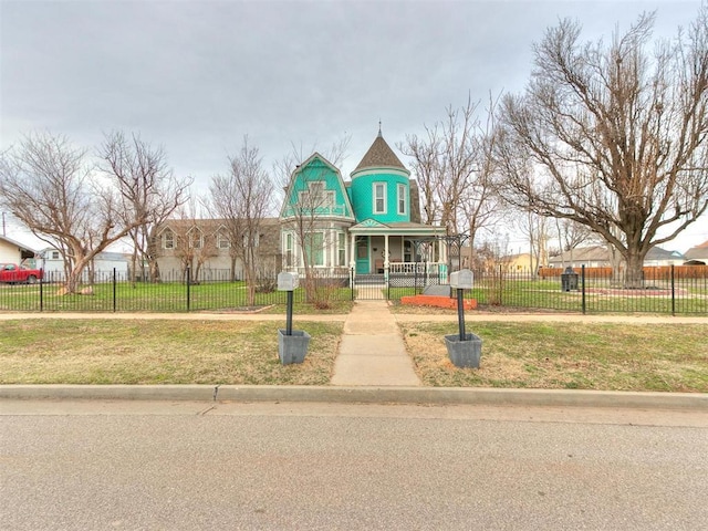 506 S Evans Ave, El Reno, OK 73036 - victorian house with a front yard and covered porch
