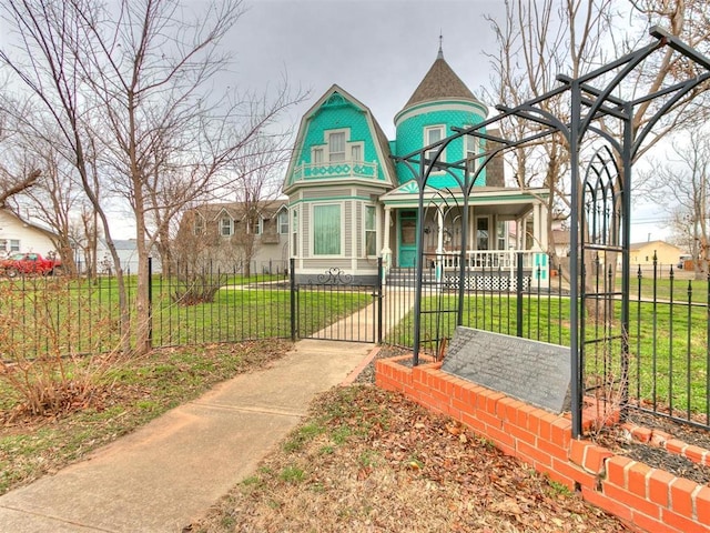 506 S Evans Ave, El Reno, OK 73036 - victorian home featuring a front yard and covered porch