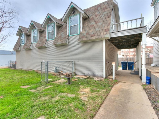 506 S Evans Ave, El Reno, OK 73036 - view of property exterior featuring a yard