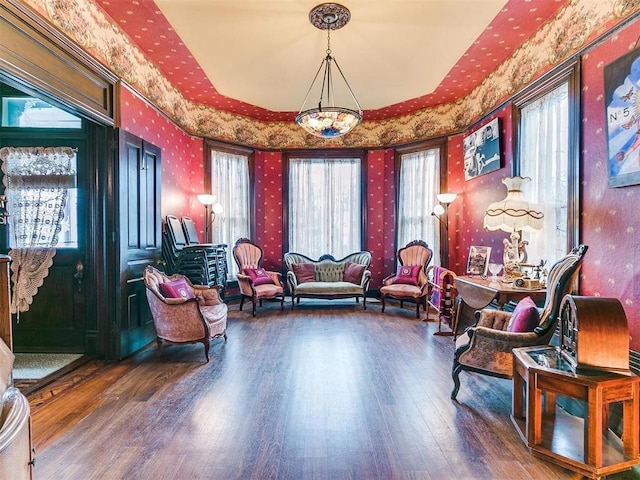 506 S Evans Ave, El Reno, OK 73036 - living area featuring hardwood / wood-style flooring, plenty of natural light, and a chandelier