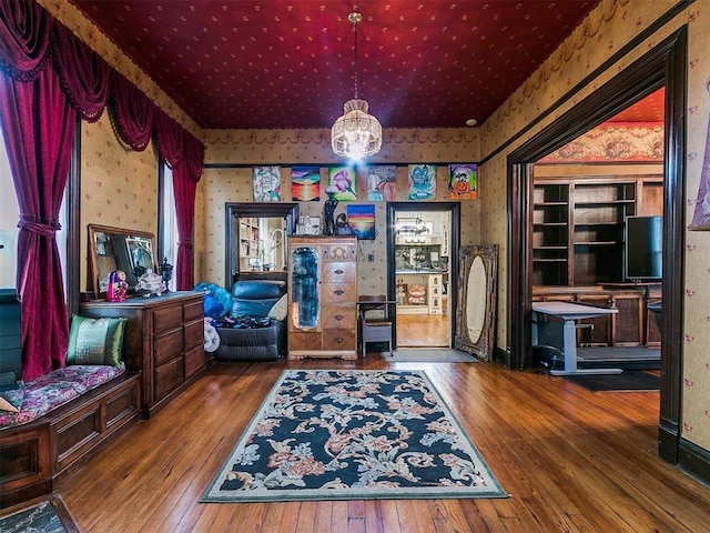 506 S Evans Ave, El Reno, OK 73036 - living area featuring hardwood / wood-style flooring and a chandelier
