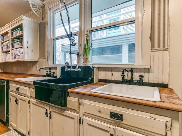 506 S Evans Ave, El Reno, OK 73036 - kitchen with wooden counters, dishwasher, and sink