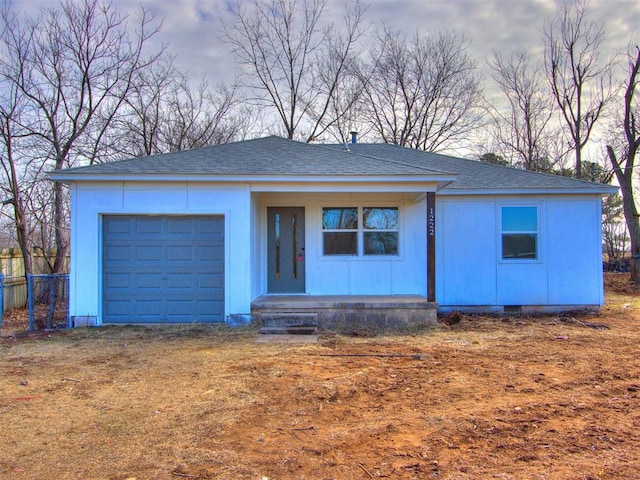 ranch-style house featuring a garage