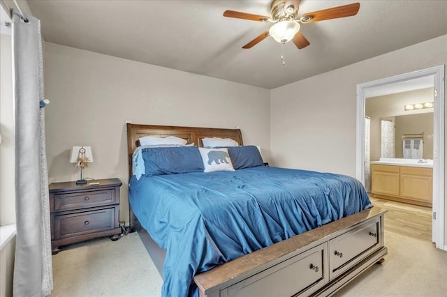 bedroom featuring ensuite bathroom and ceiling fan