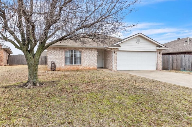 single story home with a garage and a front lawn