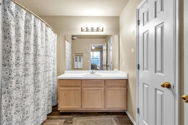 bathroom featuring vanity and hardwood / wood-style floors