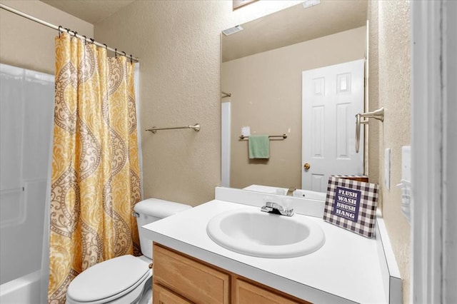 full bathroom featuring shower / bath combination with curtain, vanity, and toilet