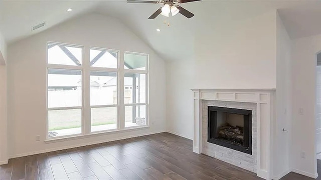 unfurnished living room with lofted ceiling, dark hardwood / wood-style floors, and ceiling fan