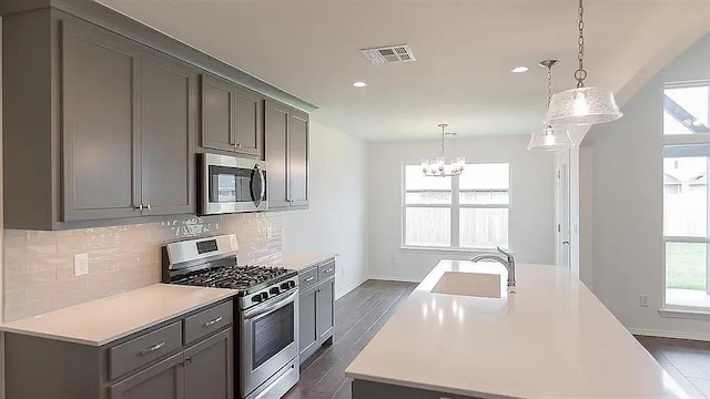 kitchen featuring a healthy amount of sunlight, appliances with stainless steel finishes, and sink