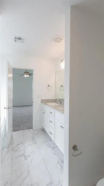 bathroom with vanity and ceiling fan