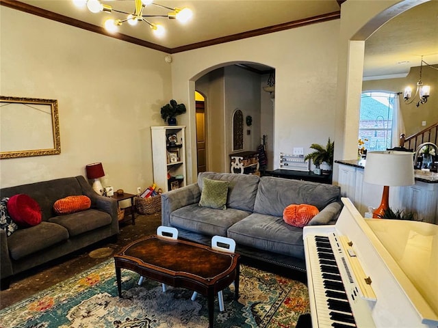 living room featuring crown molding and a notable chandelier