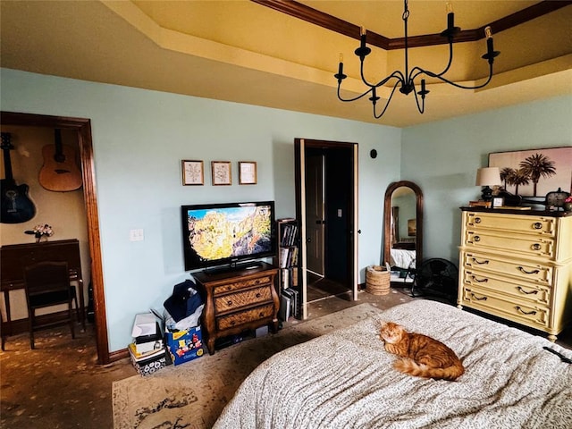 bedroom with a tray ceiling and a chandelier