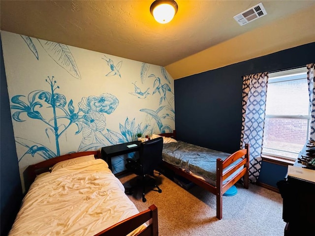 carpeted bedroom with vaulted ceiling