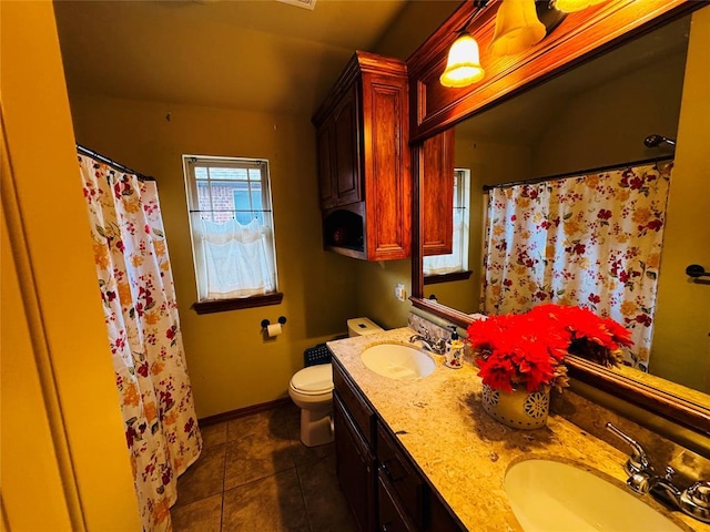 bathroom featuring vanity, curtained shower, tile patterned floors, and toilet