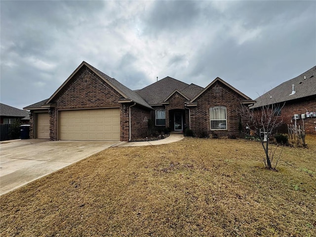 view of front of property featuring a garage and a front yard