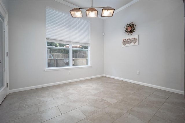 unfurnished dining area featuring crown molding