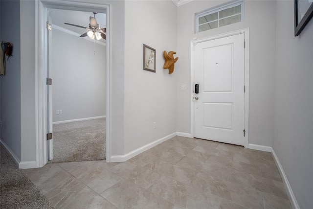 foyer featuring crown molding and ceiling fan