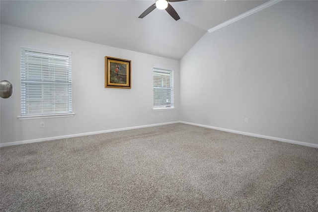 spare room with lofted ceiling, carpet floors, and ceiling fan