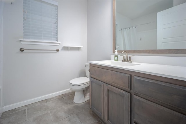 bathroom with tile patterned flooring, vanity, curtained shower, and toilet