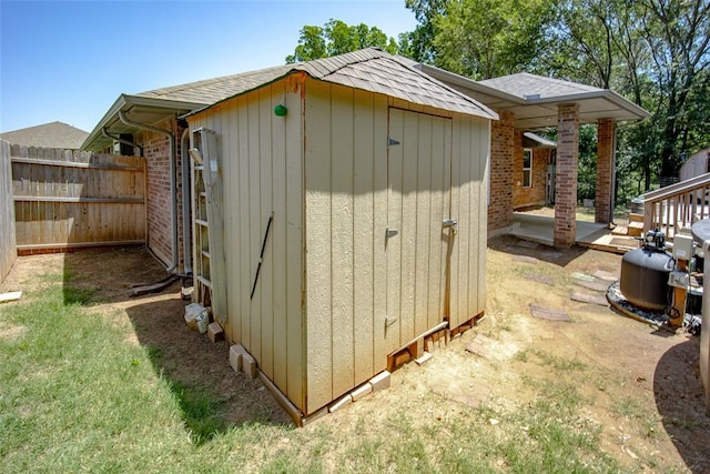 view of outdoor structure featuring a lawn