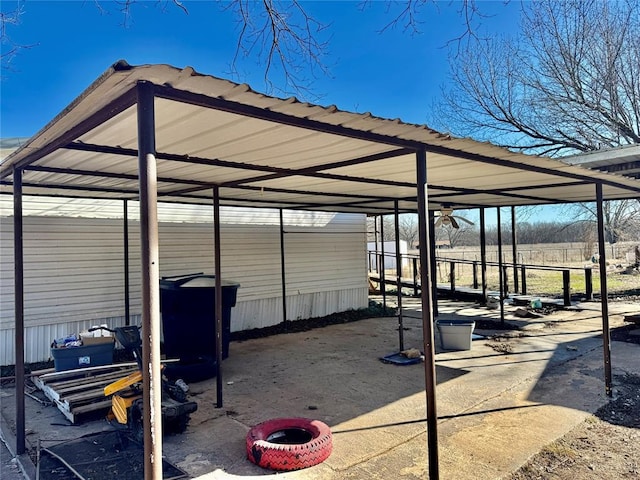 view of parking / parking lot featuring a carport