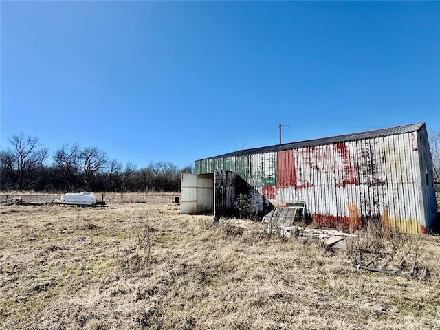 view of outbuilding featuring a rural view