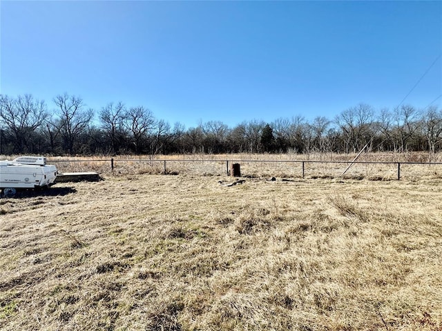 view of yard with a rural view