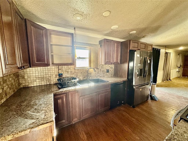 kitchen with dark wood-type flooring, sink, stainless steel fridge, dishwasher, and backsplash