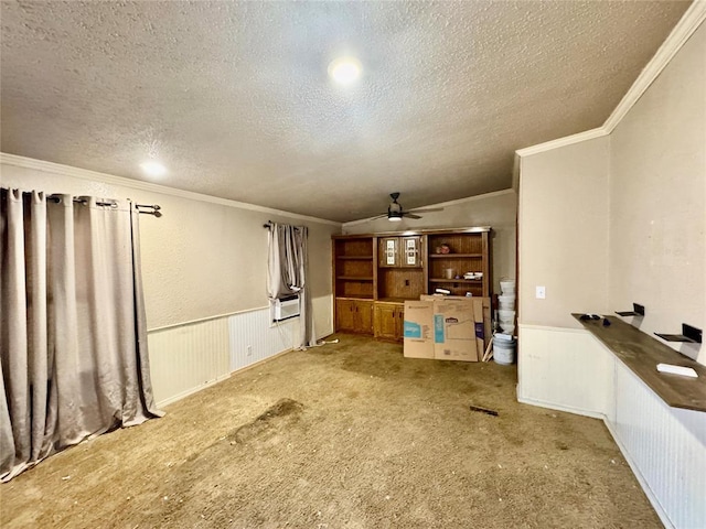 unfurnished living room featuring ornamental molding, light carpet, and a textured ceiling