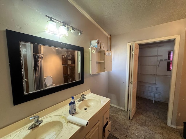 bathroom with vanity and a textured ceiling