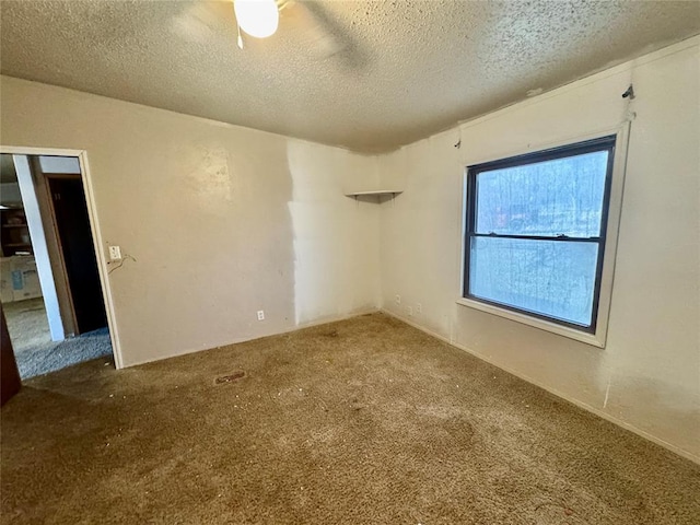 spare room featuring a textured ceiling