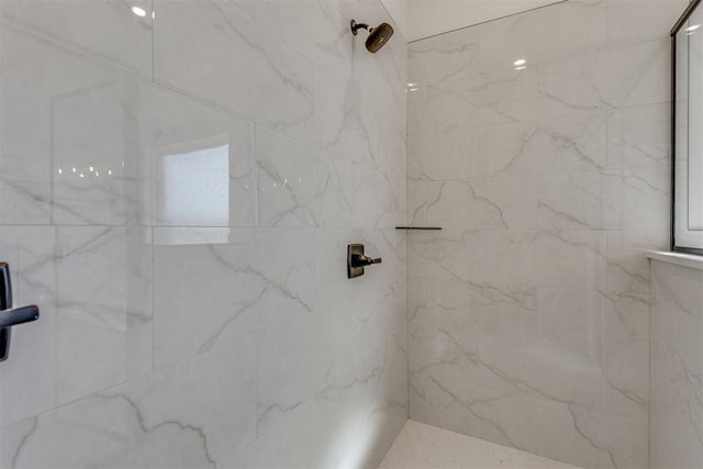 bathroom with tiled shower