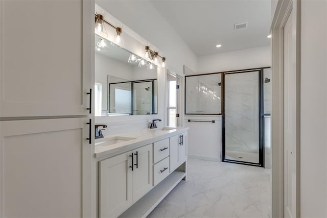 bathroom featuring vanity and an enclosed shower