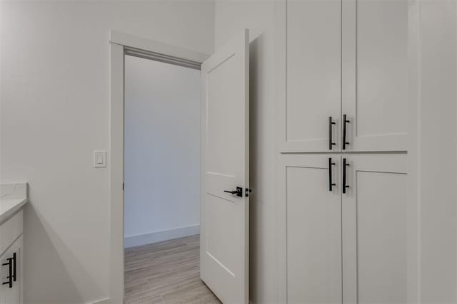 bathroom with vanity and hardwood / wood-style floors